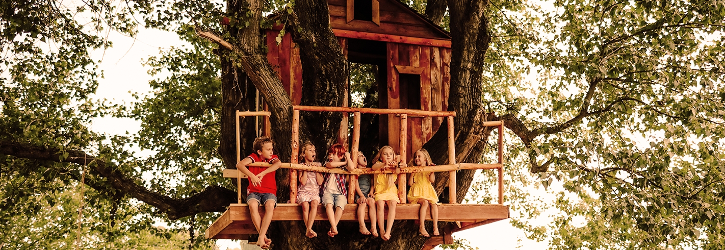 childhood friends at their favorite place in a wooden built tree house