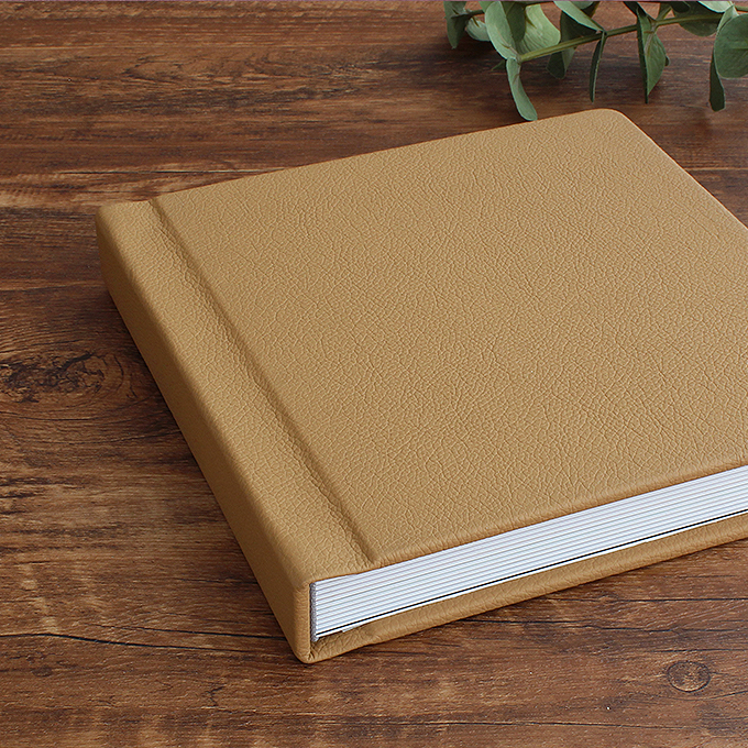 regular photo book cover added thick padding for a premium leatherette book