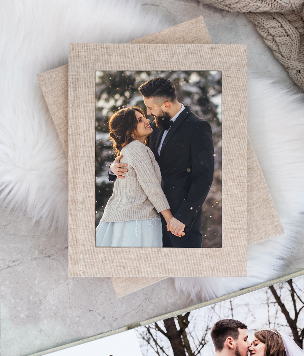 natural linen color layflat photo book with inset cameo print of wedding day couple photography in winter outdoor