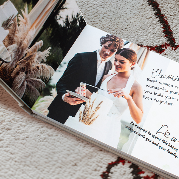 handmade rustic wedding guestbook with wood cover and vintage calligraphy perfect for boho and country weddings