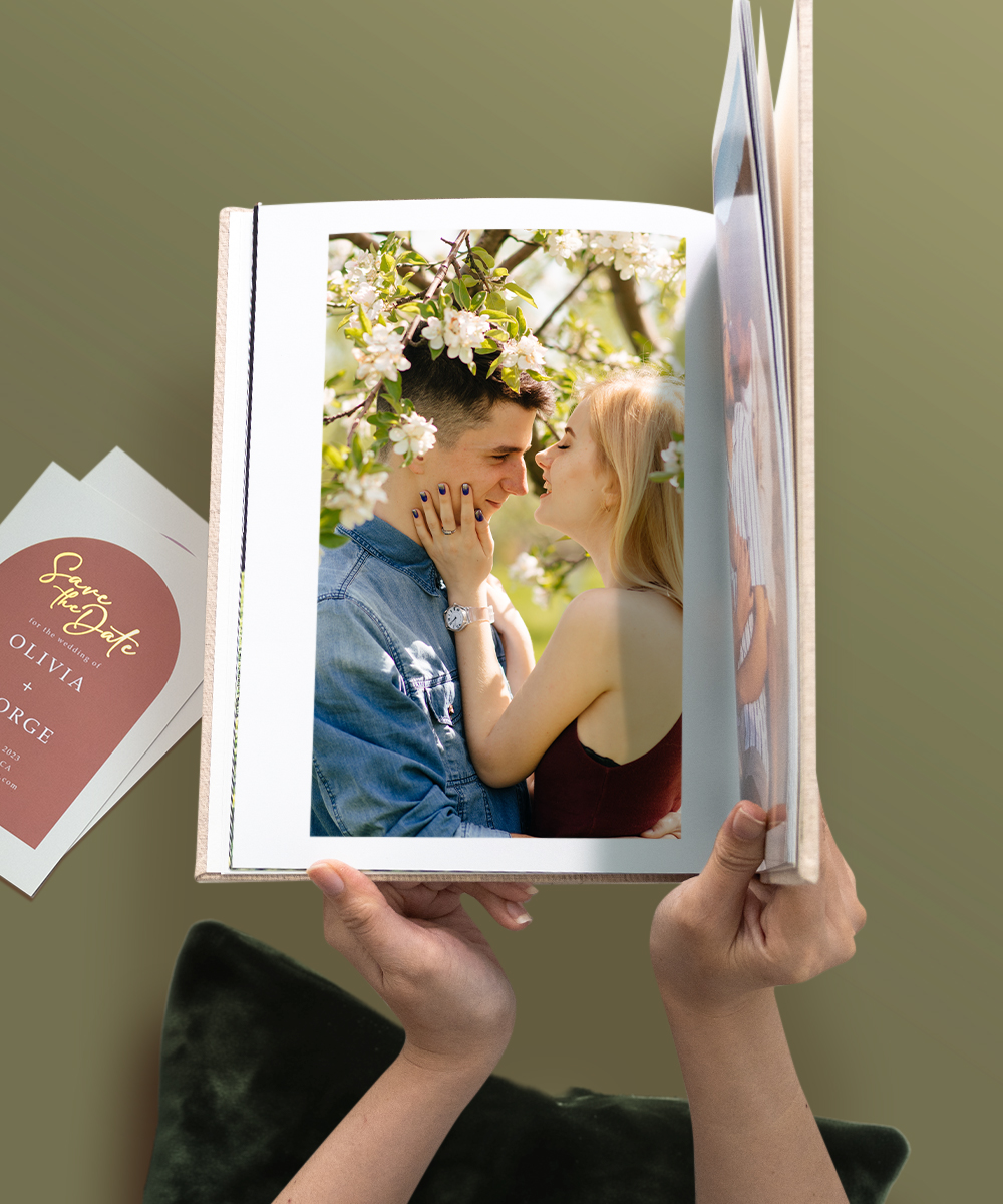 engagement wedding photo book with romantic couple under spring blossoms